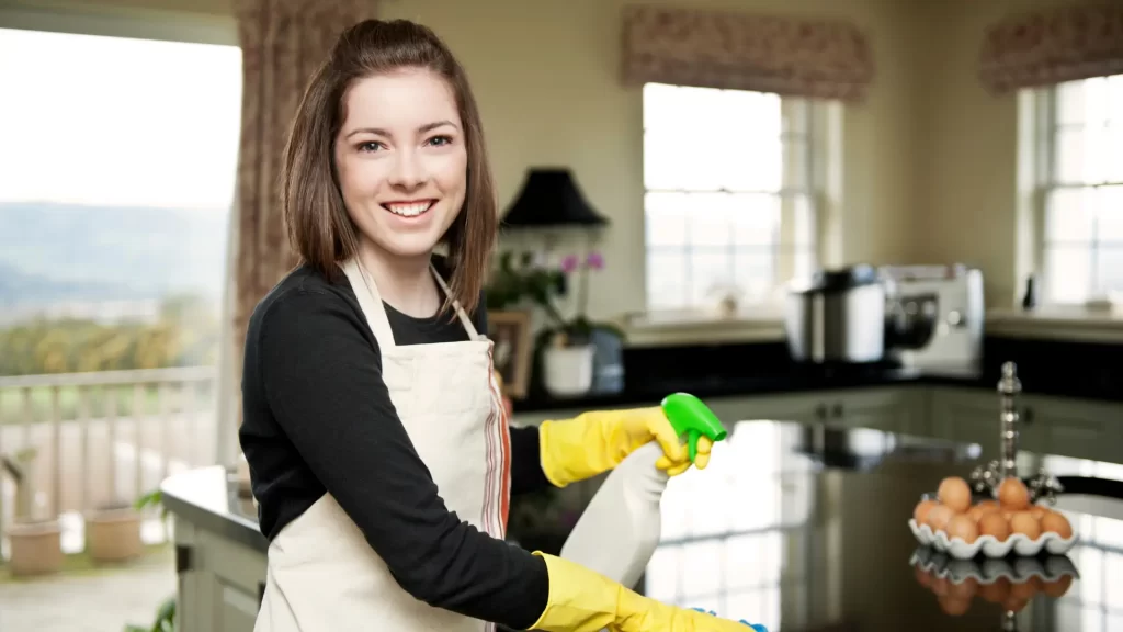 woman cleaning the kitchen